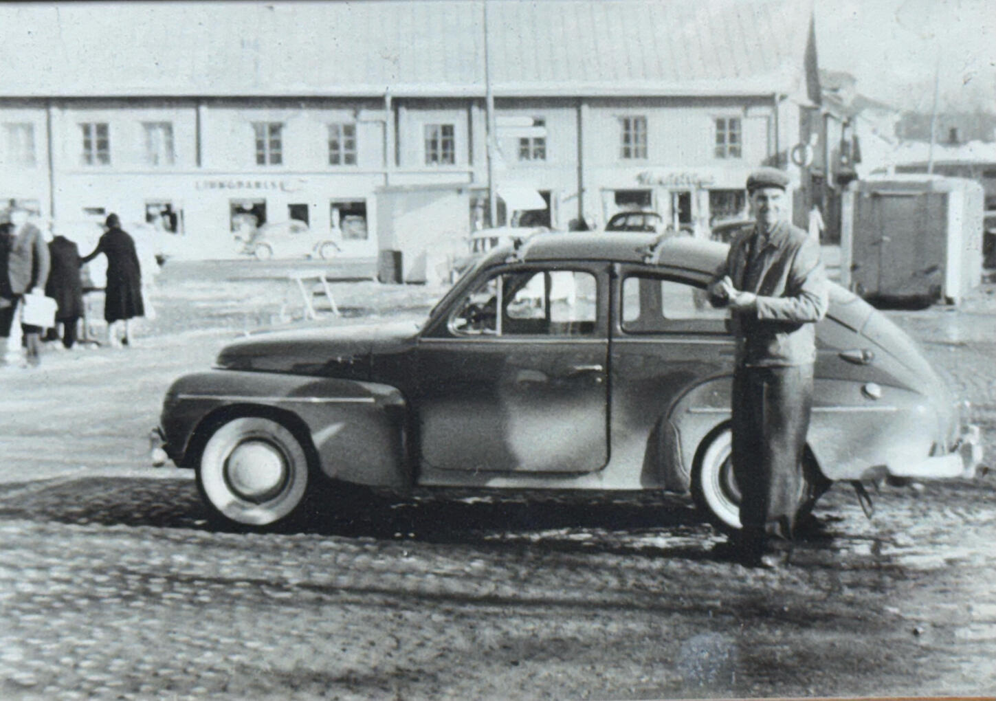 My grandfather beside his Volvo PV in the town square of Filipstad, back in the 1950s.